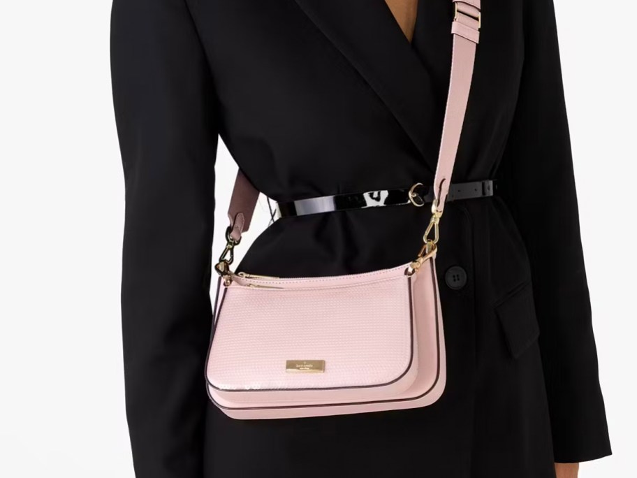 woman wearing pink sequin crossbody bag 