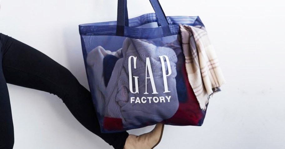 woman balancing blue GAP Factory <a href='https://online-shopping.fun/overwhelming-product-choices' target='_blank' rel='follow'>shopping</a> bag on her foot” width=”912″ height=”479″></p>
<p>Today, February 17th only, head to <a href=