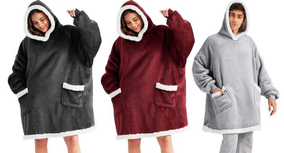 three people in black, maroon, and light grey wearable blanket hoodies