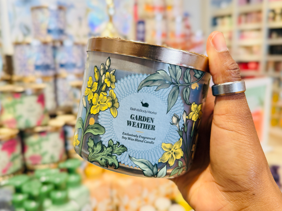 woman holding Garden Weather Candle at Bath & Body Works