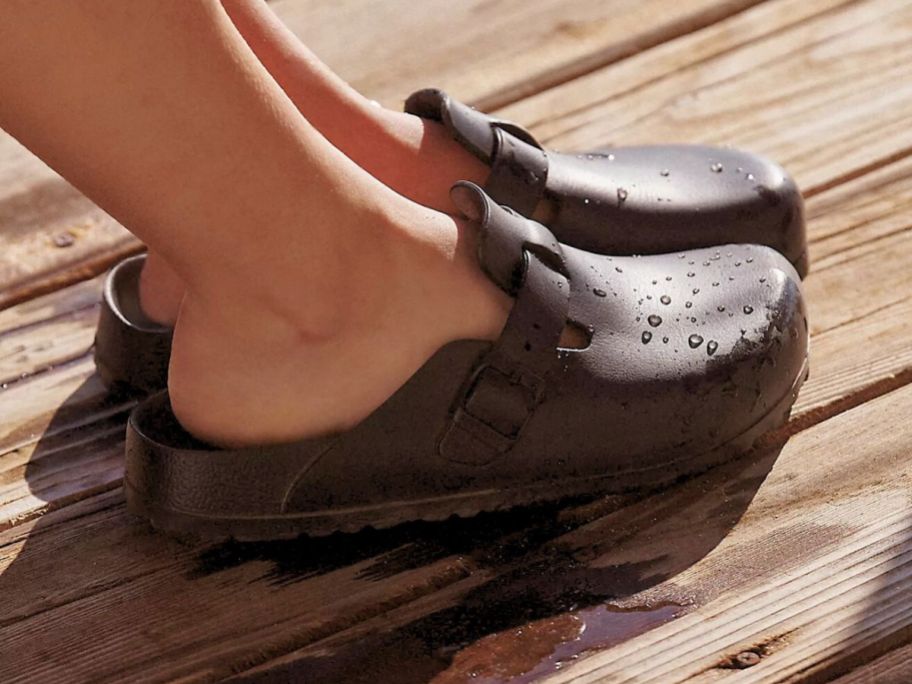 woman's feet wearing Birkenstock Women's Boston EVA Clogs