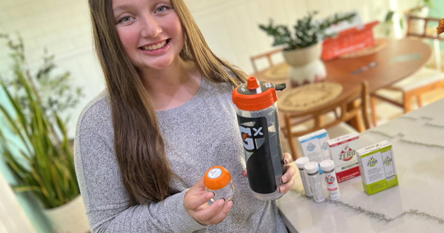 Teen girl holding custom Gx Gatorade Bottle