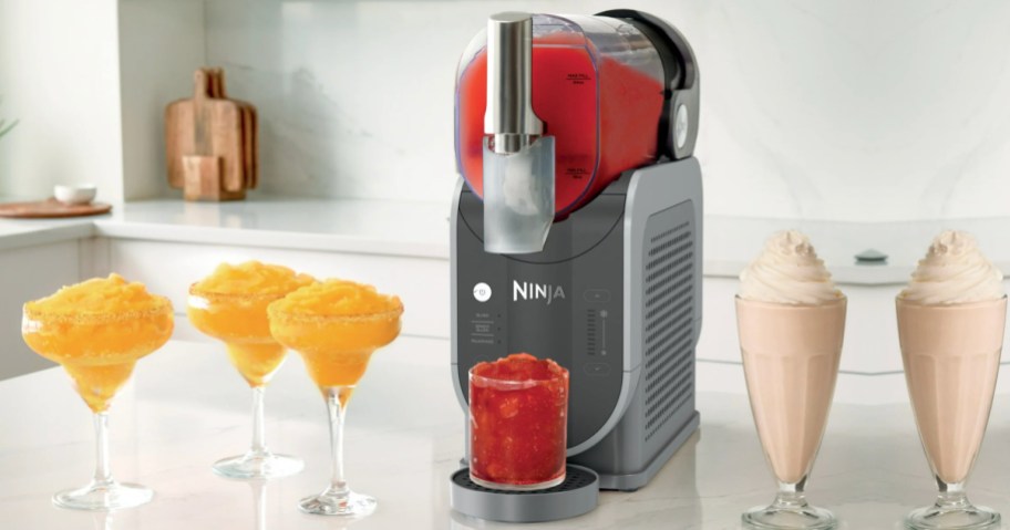 ninja slushi drink maker on countertop with drinks