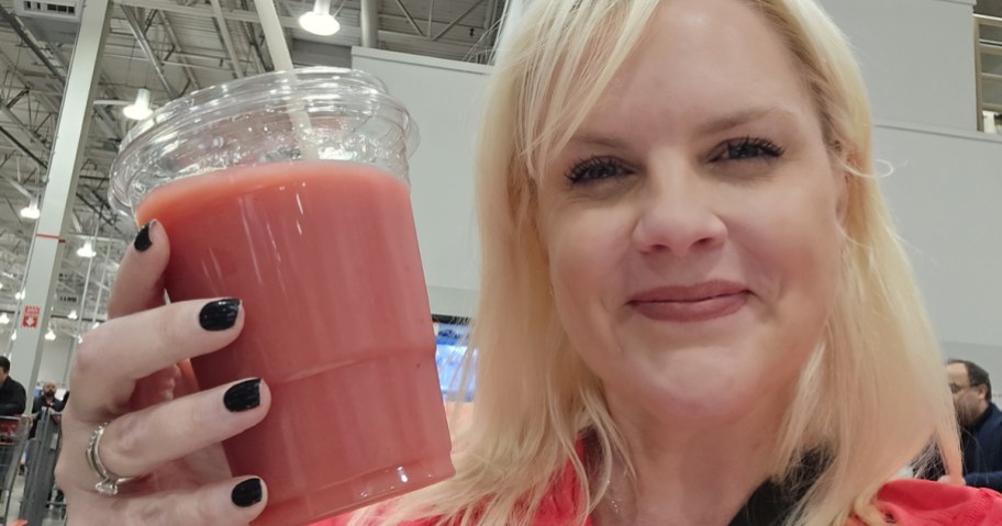 Woman holding new Costco Strawberry Banana smoothie