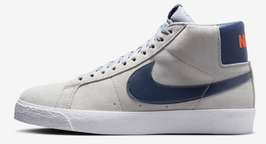 grey high top shoes with navy swoosh sign