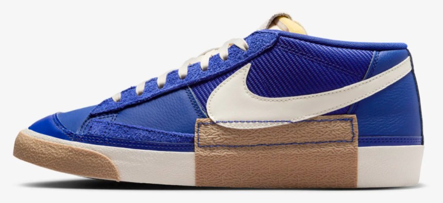 blue low top sneakers with white swoosh sign