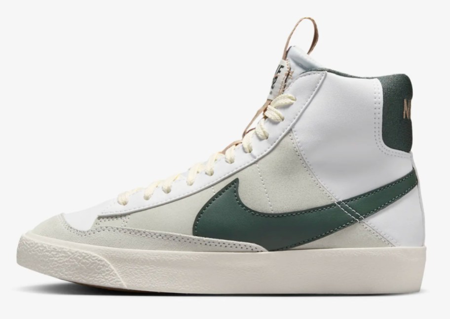 white high top sneakers with green swoosh sign