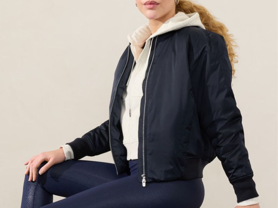 Woman wearing an Athleta Bomber Jacket