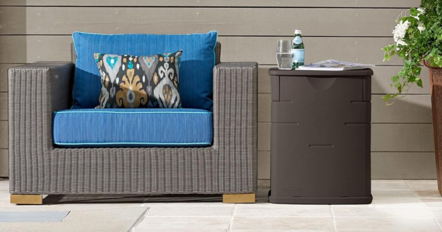 wicker chair next to brown deck box on patio