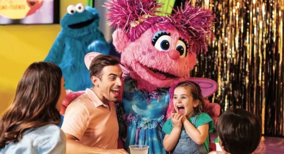 abby from Sesame street with a family