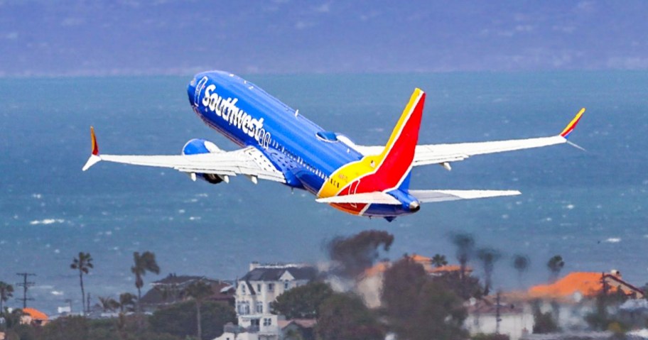 southwest plane flying over beach