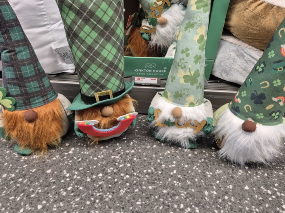 4 st. patrick's day gnomes on floor of store