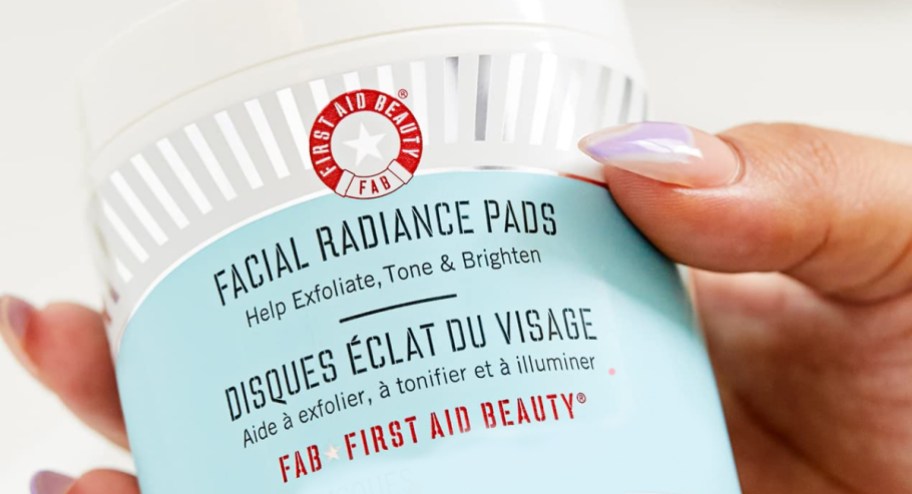 hand holding first aid beauty pads