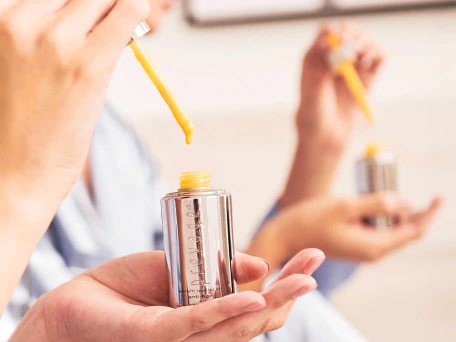 woman using the Elizabeth Arden PREVAGE + Intensive Repair Daily Serum