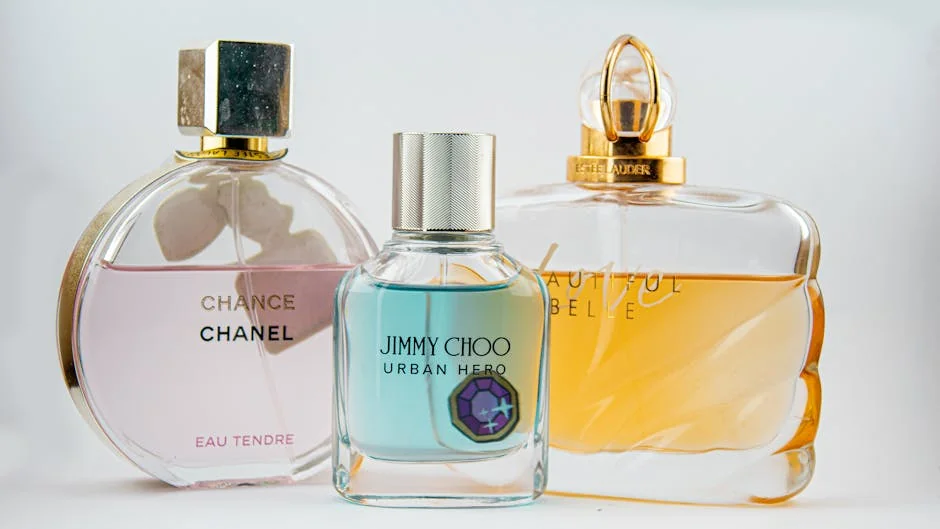 Elegant display of designer perfume bottles featuring Chanel, Jimmy Choo, and Estee Lauder. - active perfume voucher codes for first time buyers