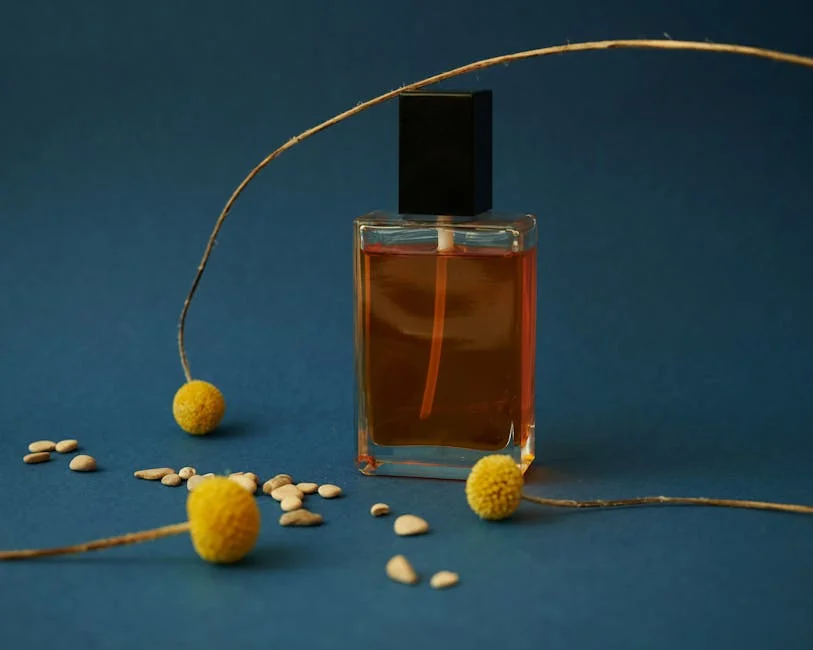 Elegant perfume bottle with yellow flowers and seeds on a blue background. Perfect for product mockups. - active perfume voucher codes for first time buyers