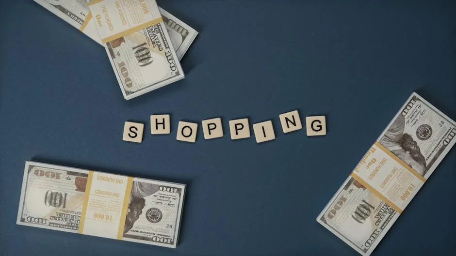 Stacked US dollars around shopping letters on a blue background. - shopping savings money - Best cashback apps to use with online coupons