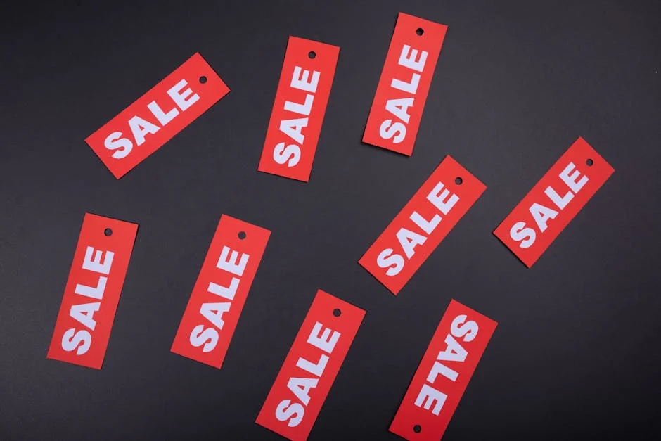 Red sale tags on a black background. Ideal for marketing and promotional use. - how to combine manufacturer coupons with store sales