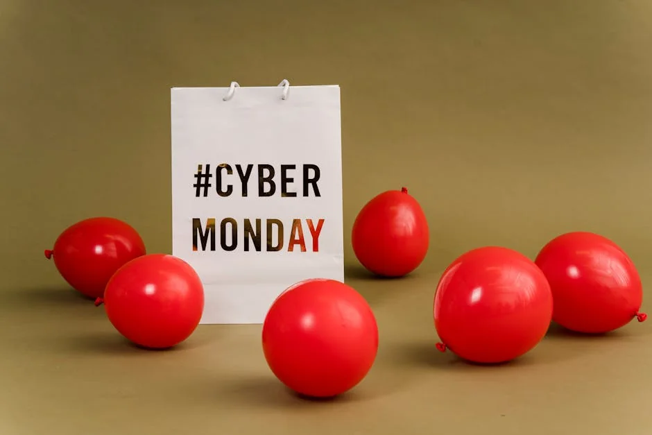Shopping bag with hashtag Cyber Monday surrounded by vibrant red balloons. - cyber monday early access deals for subscribers
