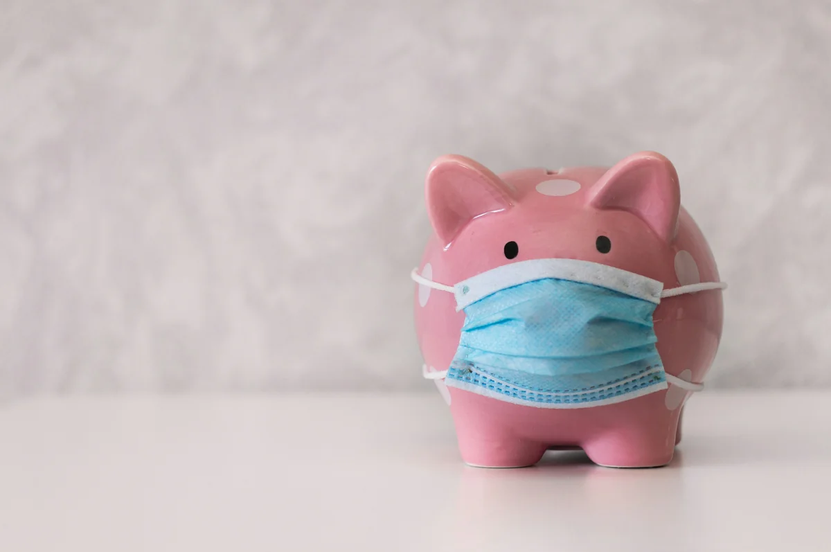 a pink piggy bank wearing a face mask - piggy bank money - How to find crazy savings on premium brand names
