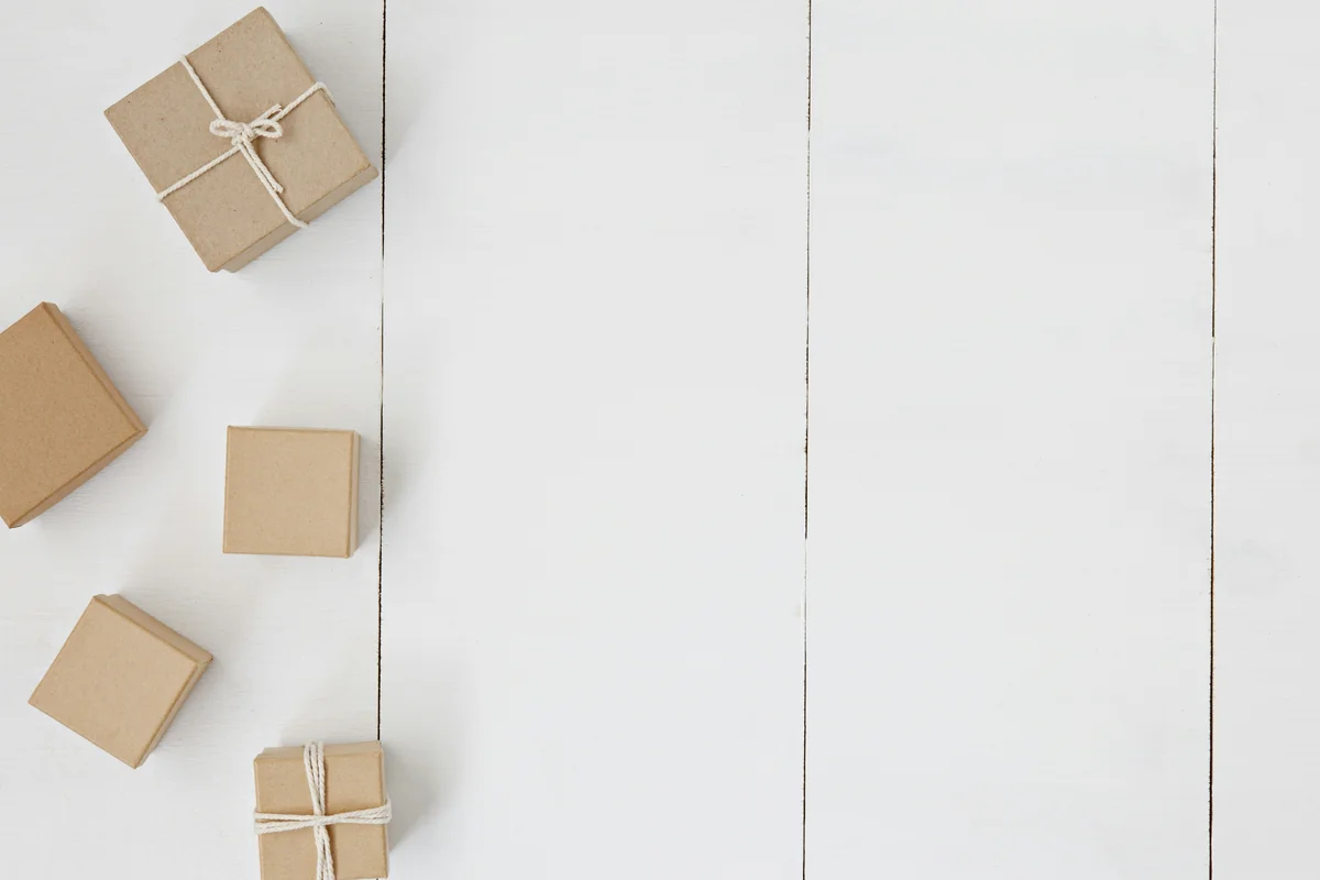 brown gift box on white surface - how to get free shipping on international orders