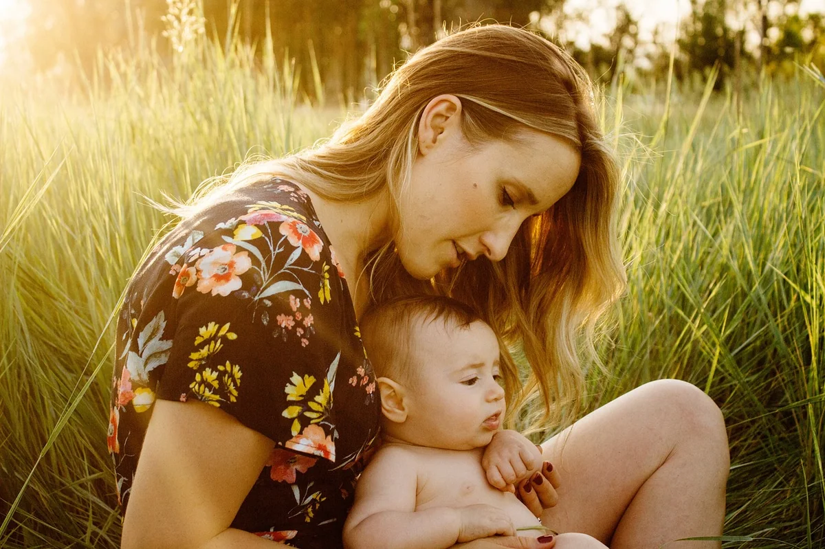 mother, baby, child, field, motherhood, parent, parenthood, infant, family, girl, grass, love, woman, happy mothers day, sit, sitting, outdoors, nature, portrait, golden light, mum, mom - mothers day jewelry sale and free shipping codes