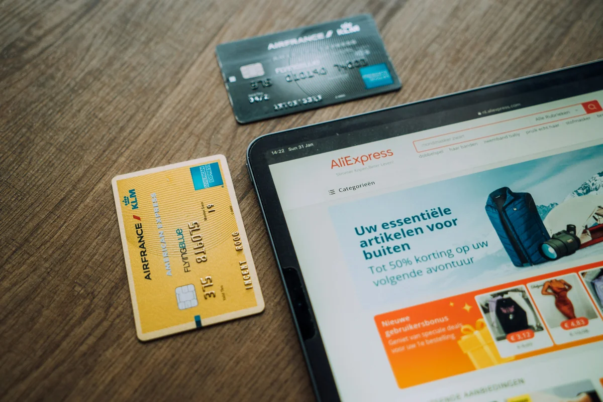 black android smartphone on brown wooden table - redeemable gift card codes for online retailers