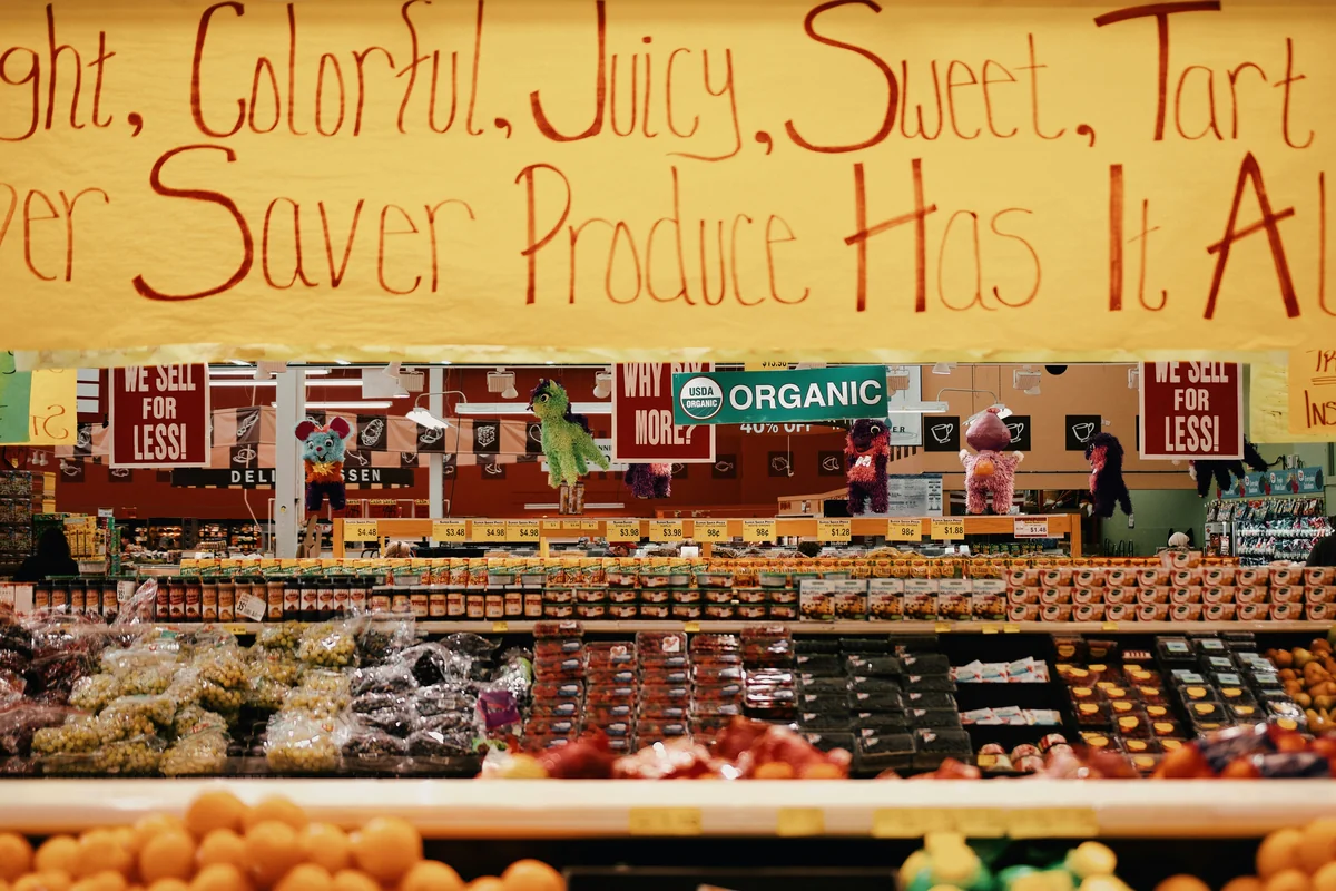assorted fruits on rack - how to save money on organic groceries with coupons