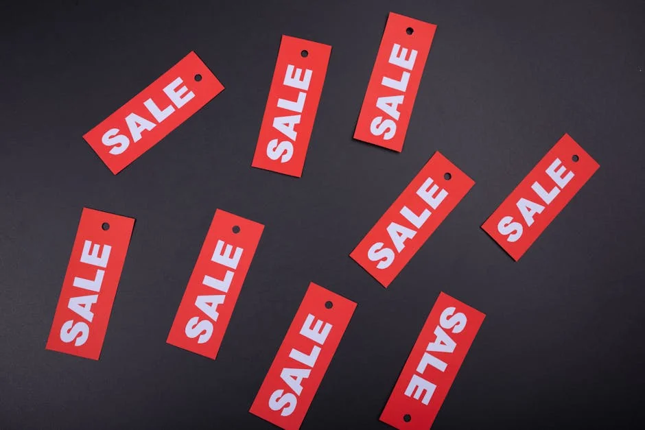Red sale tags on a black background. Ideal for marketing and promotional use. - unbeatable clearance sale prices on winter clothing