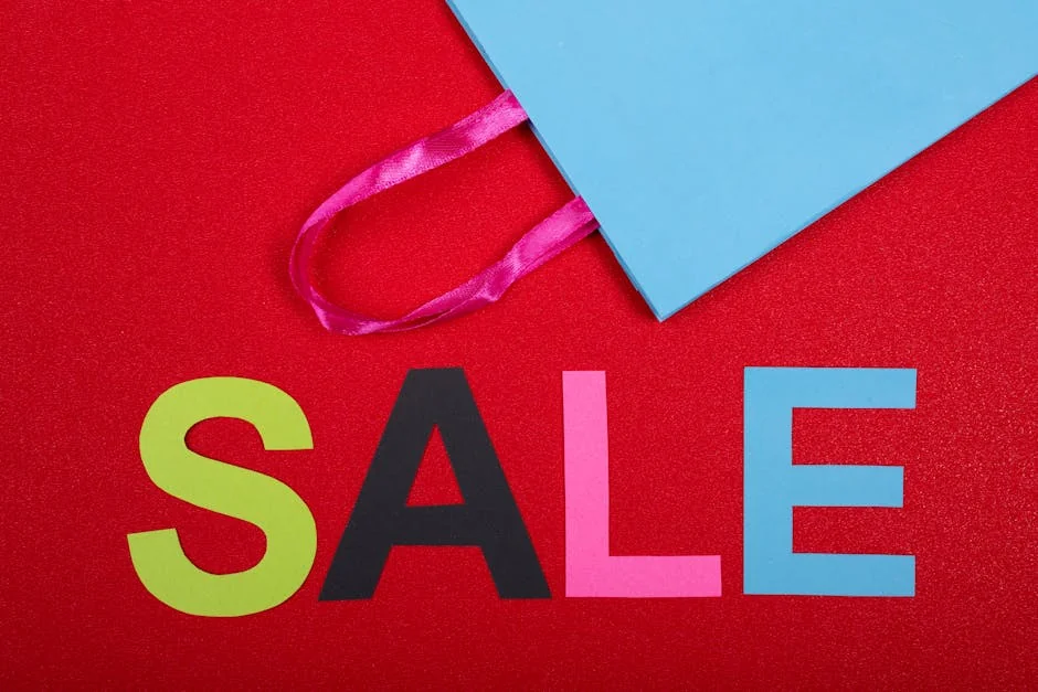 Vibrant shopping sale design with colorful letters and blue bag against a red backdrop. - unbeatable clearance sale prices on winter clothing